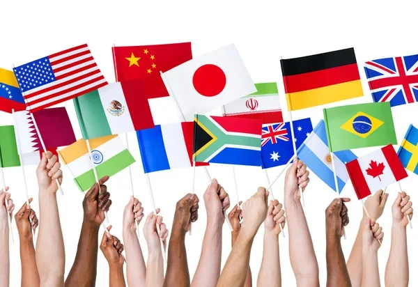 multi color hands holding flags of different countries